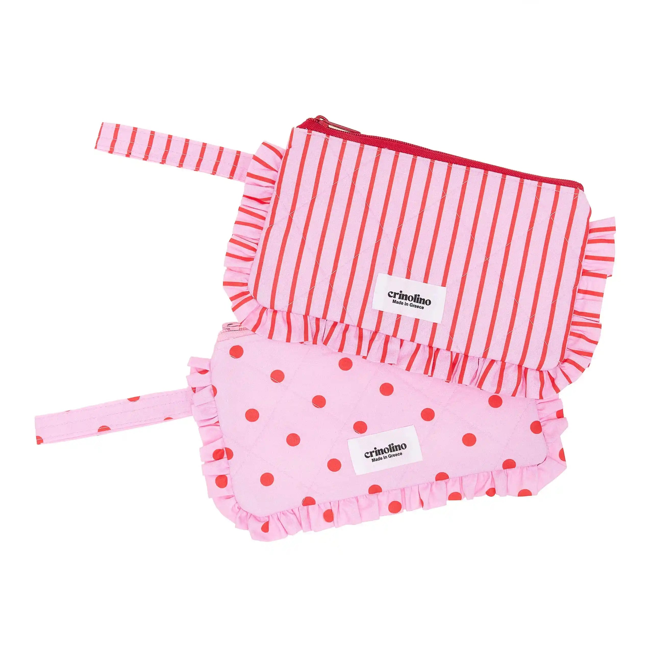Pink and red striped long-sleeve top and pink polka dot shorts with 'crinoline' label on a white background