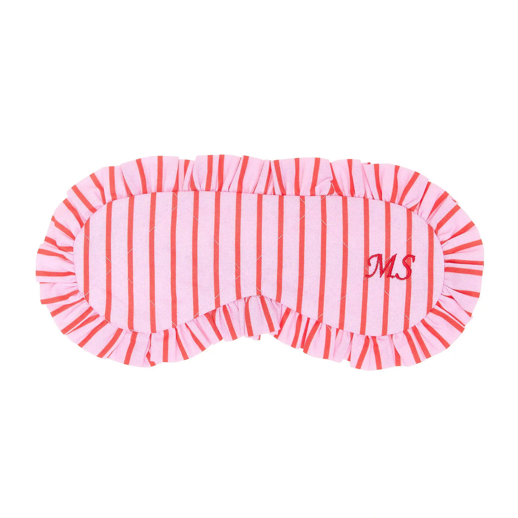 Pink and red striped eye mask with 'MS' initials on a white background