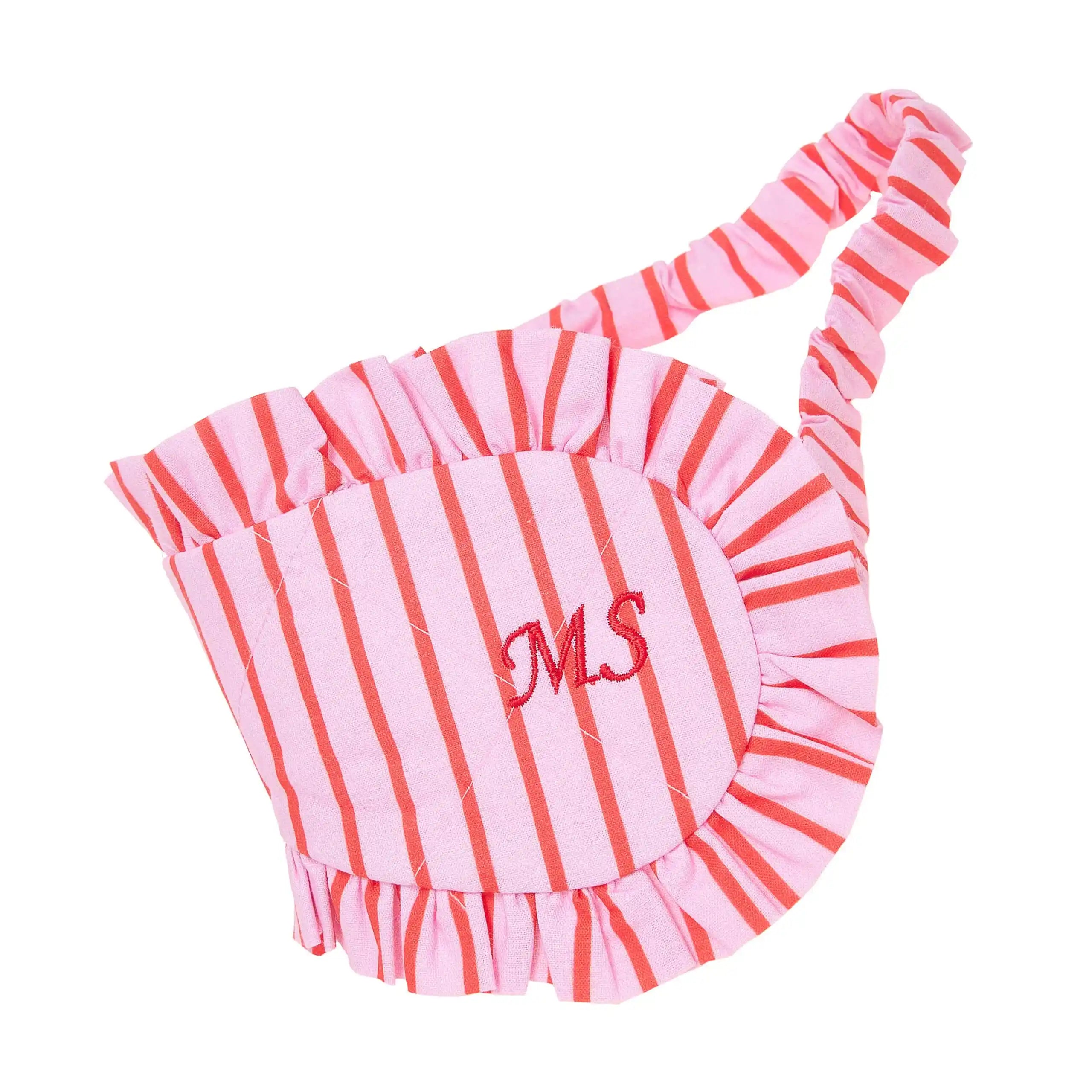 Pink and red striped pet dress with 'MS' monogram on a white background