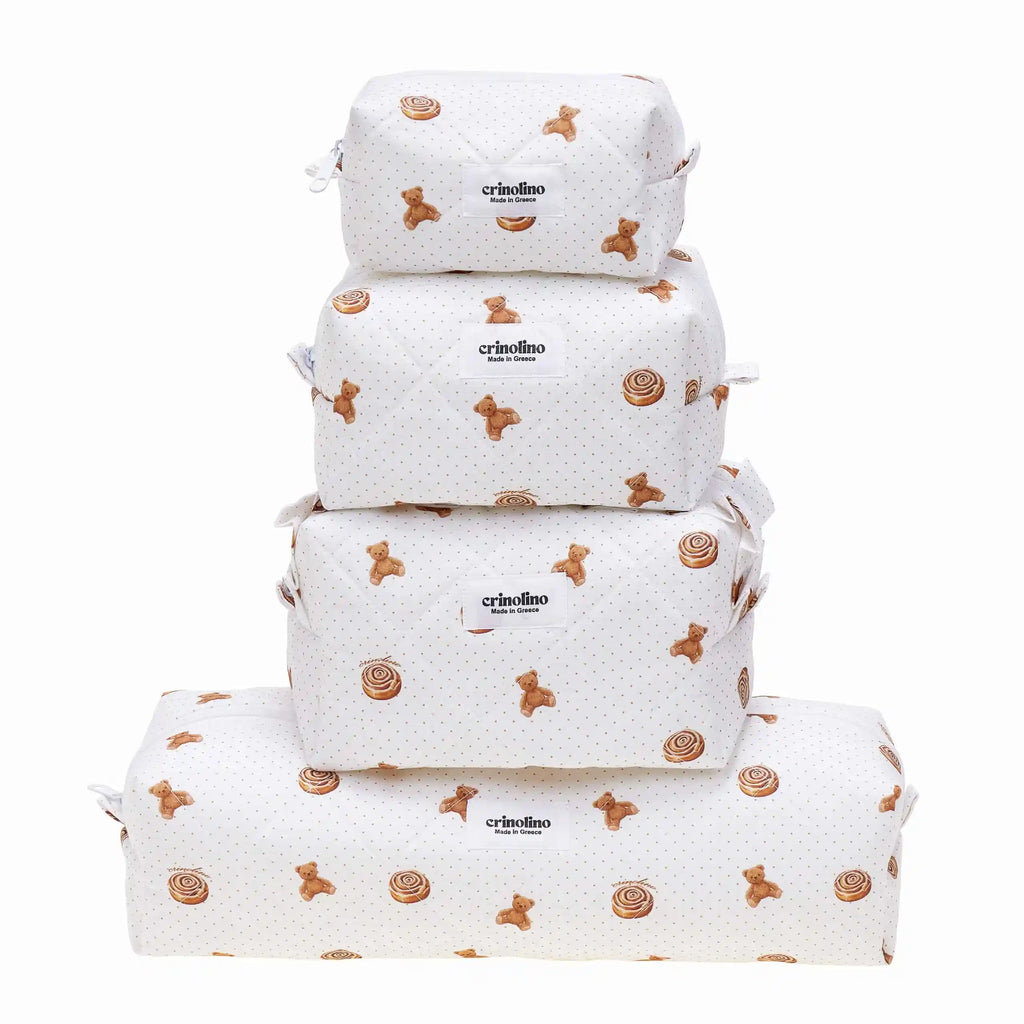 Set of four white bags with brown patterns and 'criollino' branding on a white background