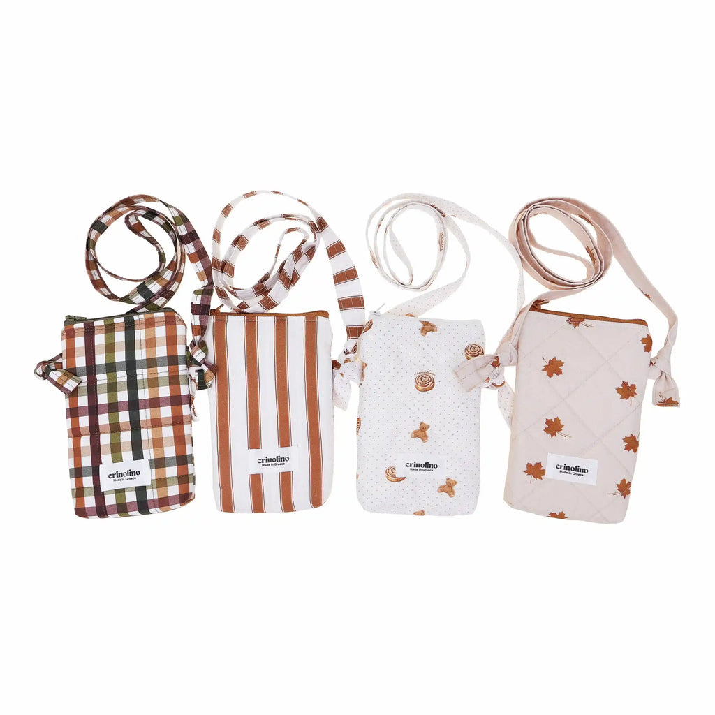 Four small bags with straps on a white background