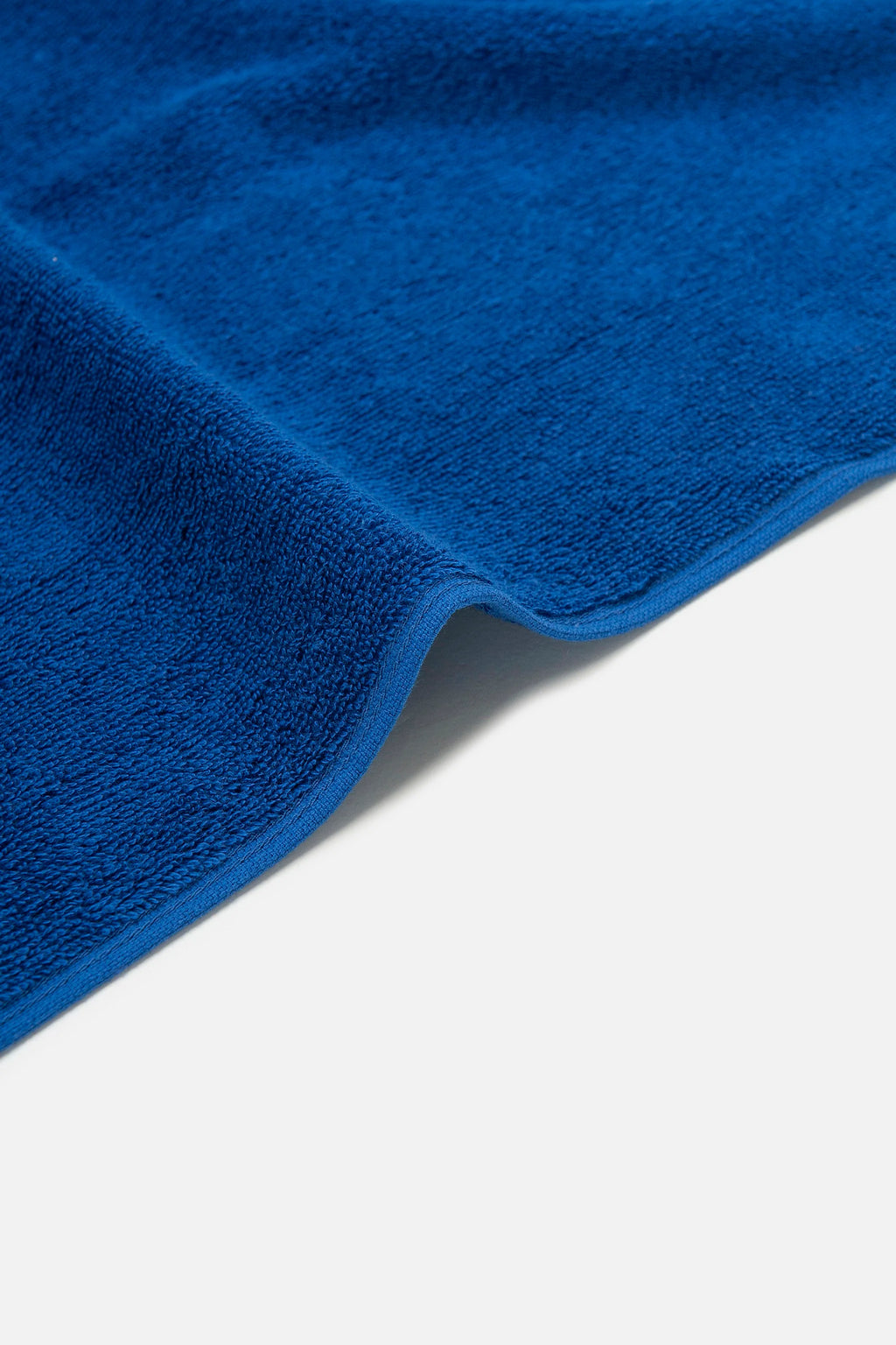 Close-up of a blue towel on a white background