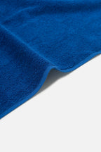 Close-up of a blue towel on a white background