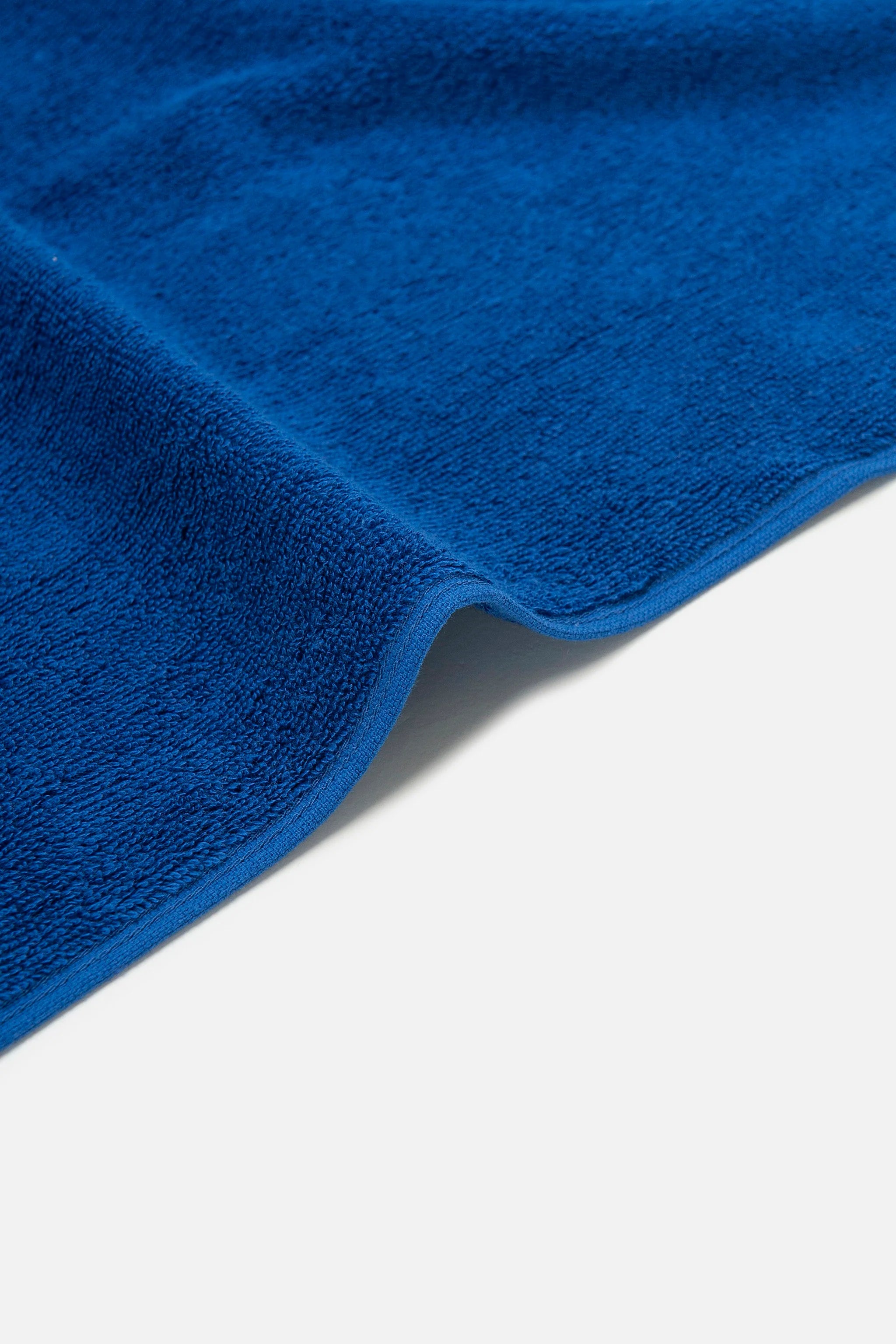 Close-up of a blue towel on a white background