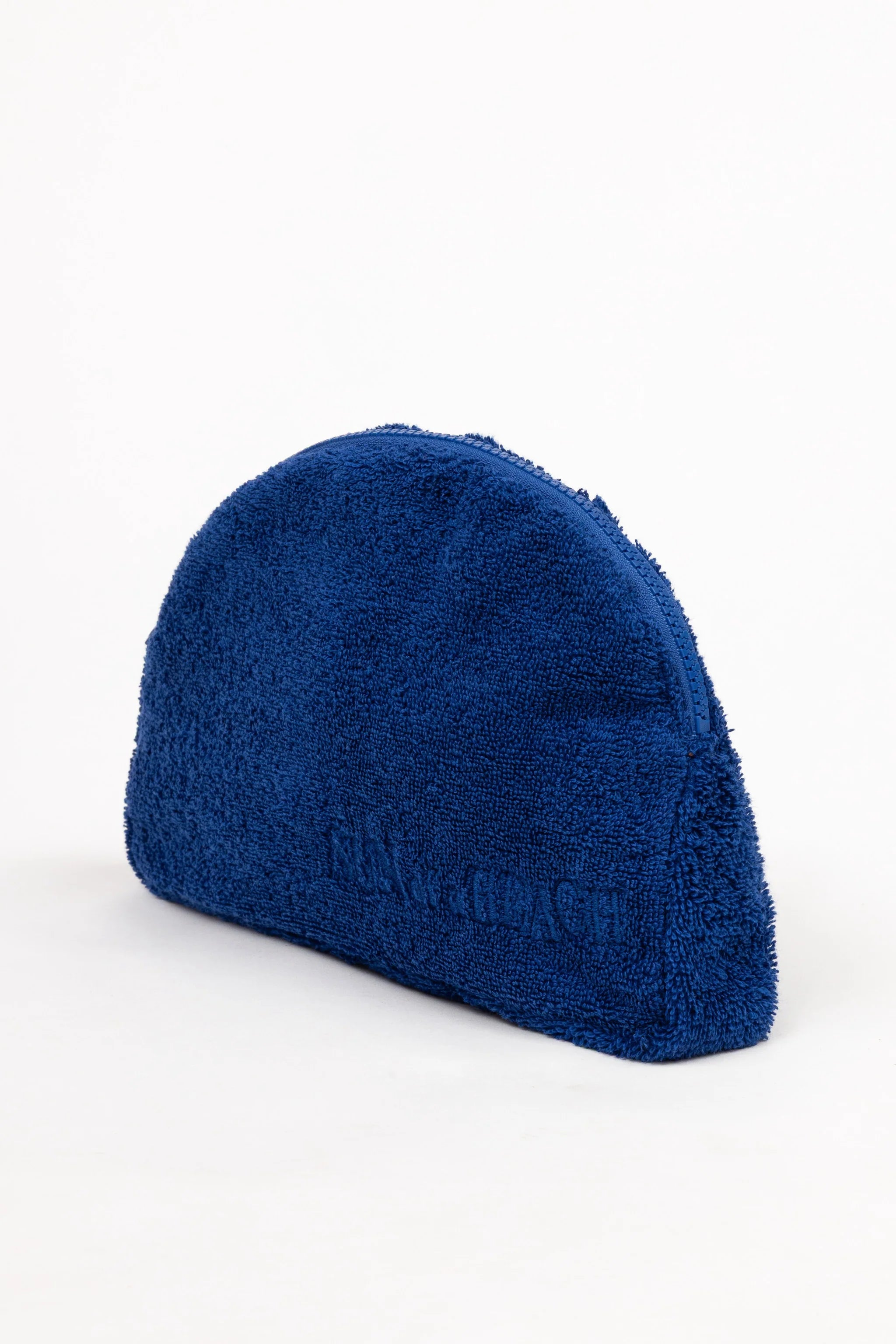 Blue fuzzy beanie on a white background
