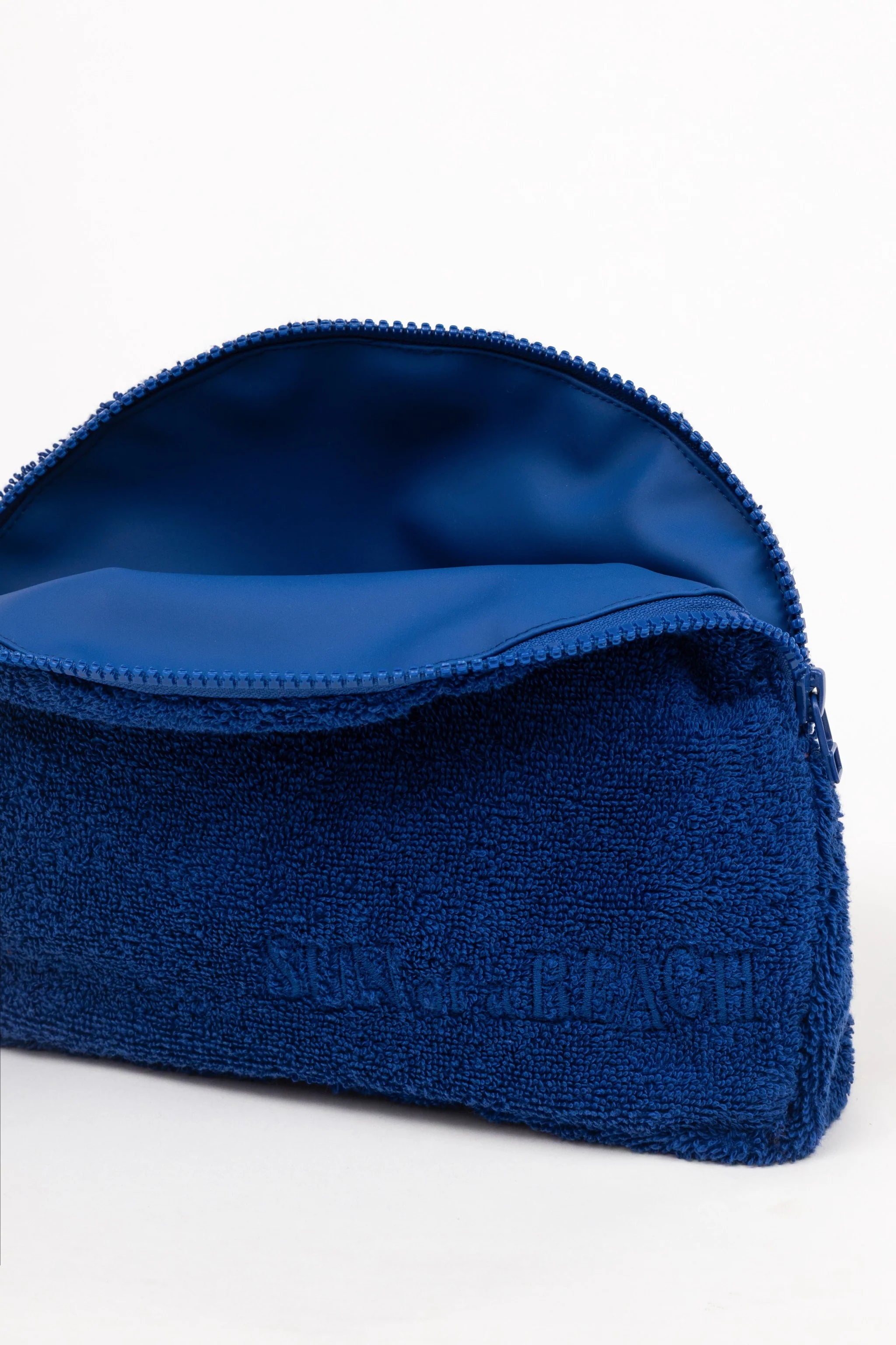 Blue towel with brand logo on a white background