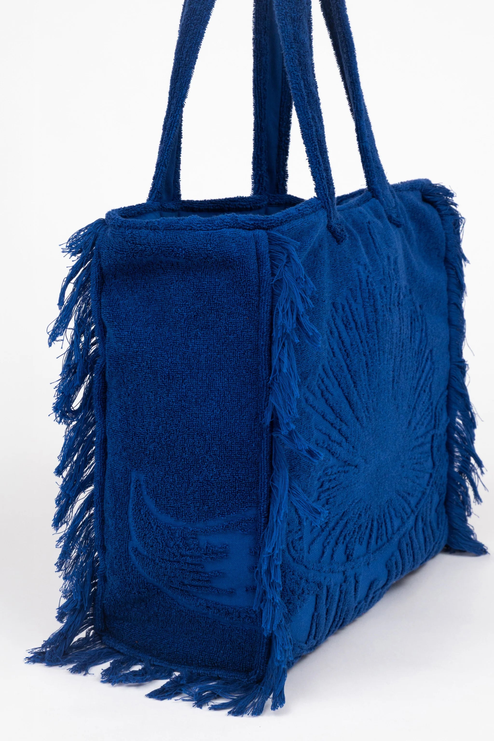 Blue fringed bag on a white background