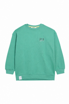 A mint green crewneck sweatshirt with a small embroidered 'PCP.