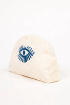 Beige beanie with blue eye design and text on a white background