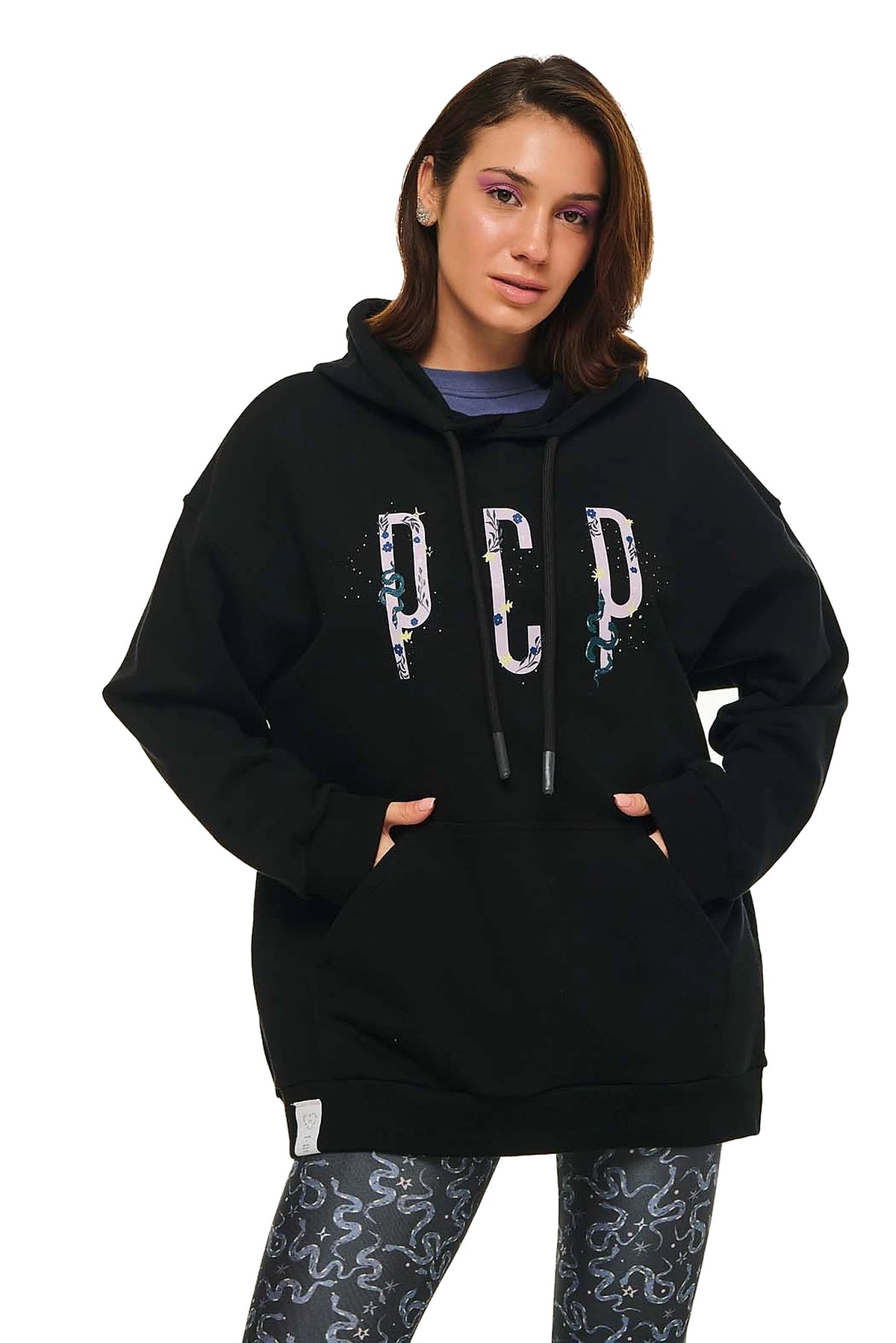 Person wearing a black hoodie with 'PCP' logo on a white background