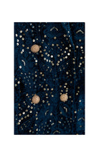 A close-up of a dark navy blue fabric with intricate gold sequin embroidery and beadwork, featuring three prominent round gold floral embellishments.