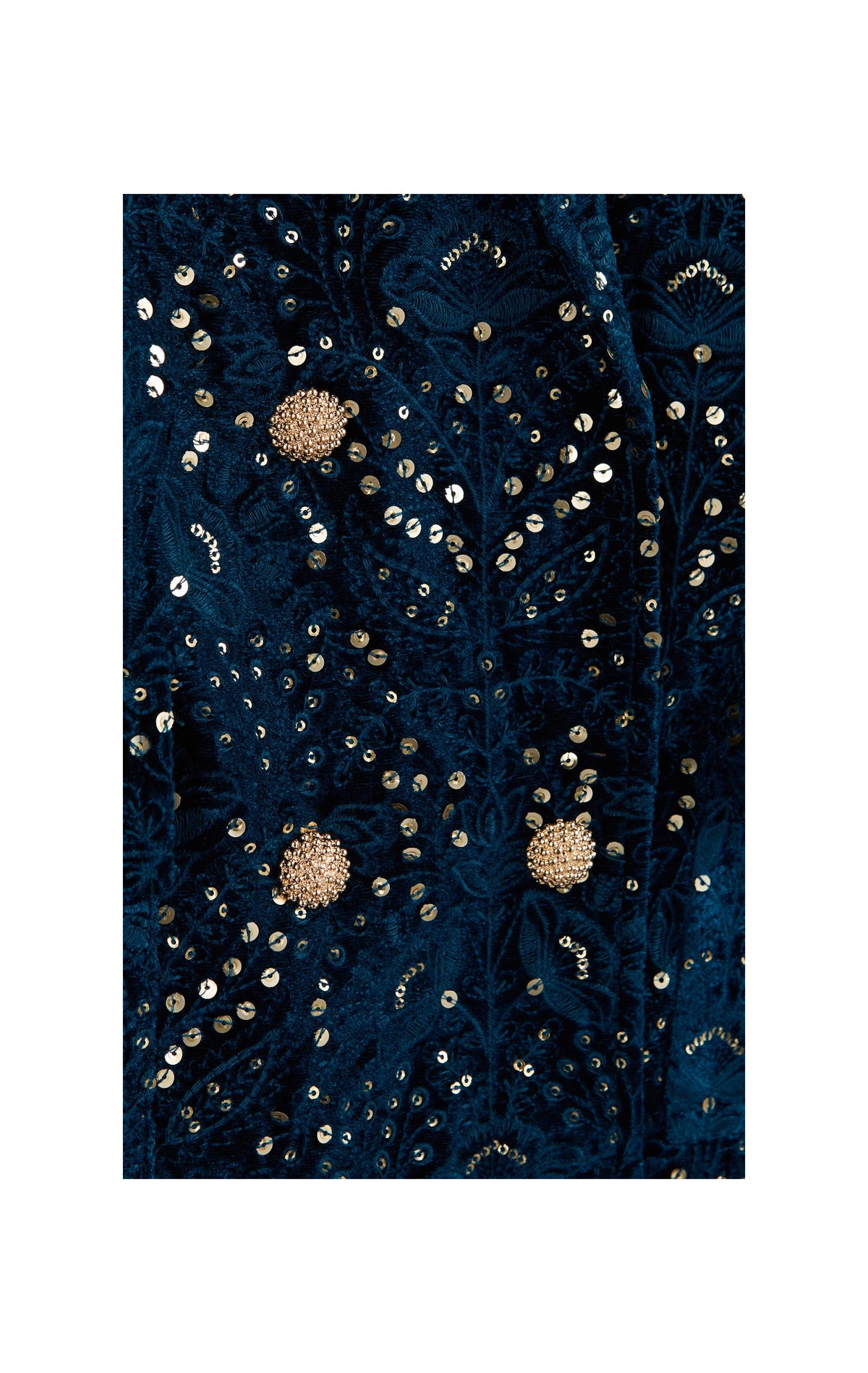 A close-up of a dark navy blue fabric with intricate gold sequin embroidery and beadwork, featuring three prominent round gold floral embellishments.