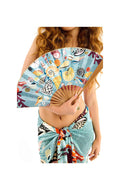 Woman holding a colorful hand fan with a tropical design on a white background