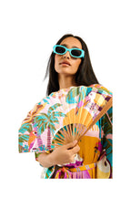 Woman holding a colorful fan with a white background