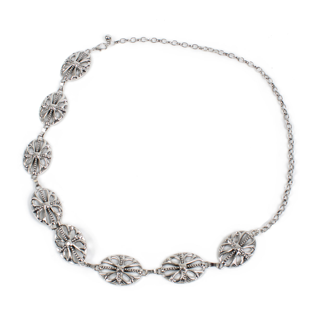 A silver-toned chain necklace featuring five ornate, textured oval links with intricate floral and scrollwork details, displayed on a clean white background.
