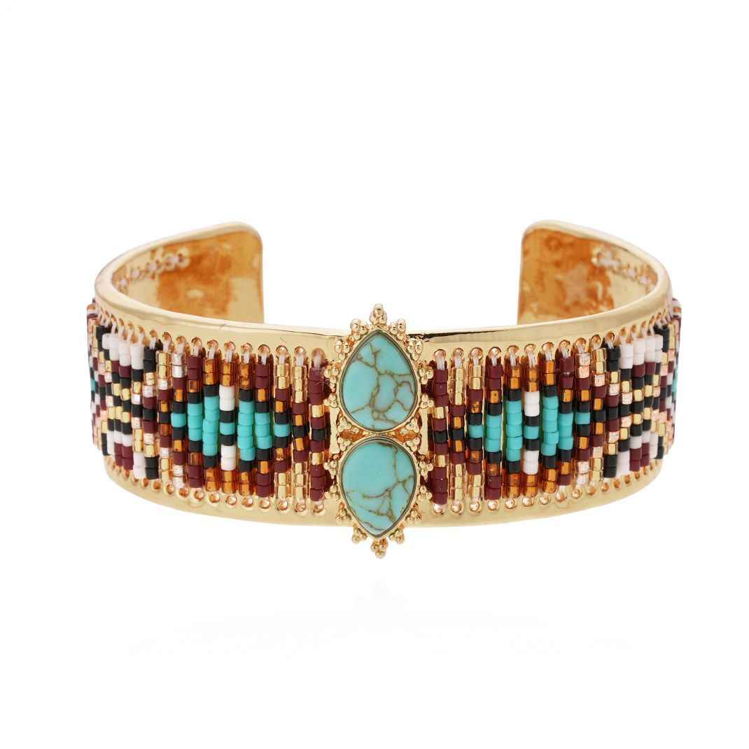 Beaded bracelet with turquoise stones on a white background