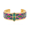 Multicolored beaded bracelet with gold accents on a white background