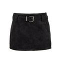 A black suede mini skirt with a matching black belt and a silver buckle, shown against a plain white background.