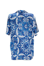 Blue and white patterned shirt on a white background