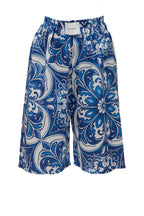 Blue and white patterned shorts on a white background