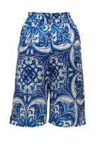 Blue and white patterned shorts on a white background