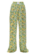 Trousers with lemon and leaf pattern on a white background