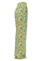Pants with lemon and leaf pattern on a white background