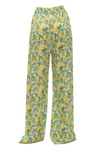 Pajama pants with lemon pattern on a white background