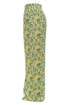 Pants with lemon and leaf pattern on a white background