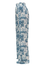Tropical patterned pants on a white background