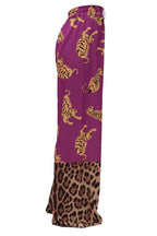 Purple pants with tiger and leopard print on a white background