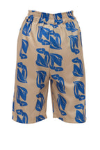 Beige pants with blue leaf pattern on a white background