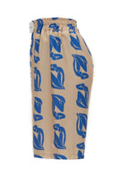Beige shorts with blue leaf pattern on a white background