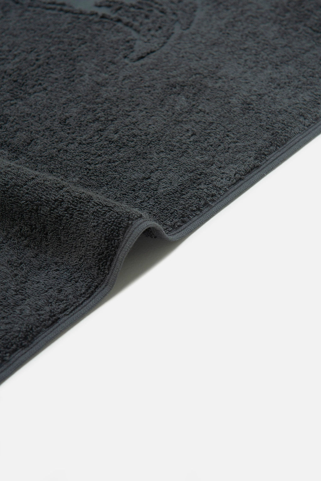 Dark gray car mat on a white background