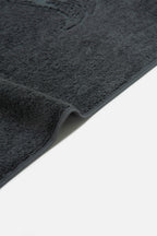 Dark gray car mat on a white background