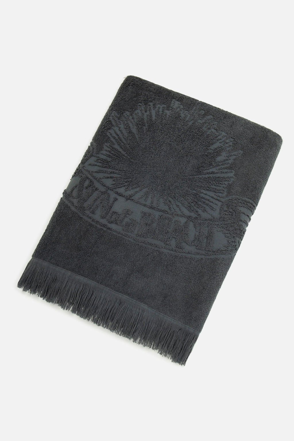 Dark gray towel with fringes on a white background