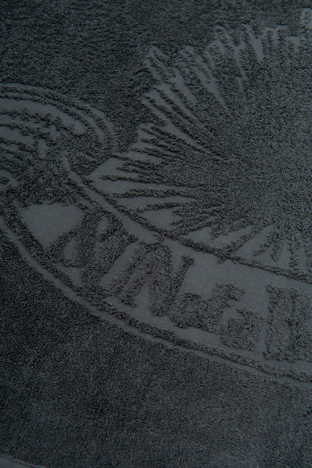 Close-up of a textured surface with a logo or brand name.