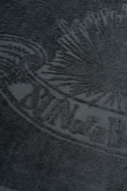 Close-up of a textured surface with a logo or brand name.
