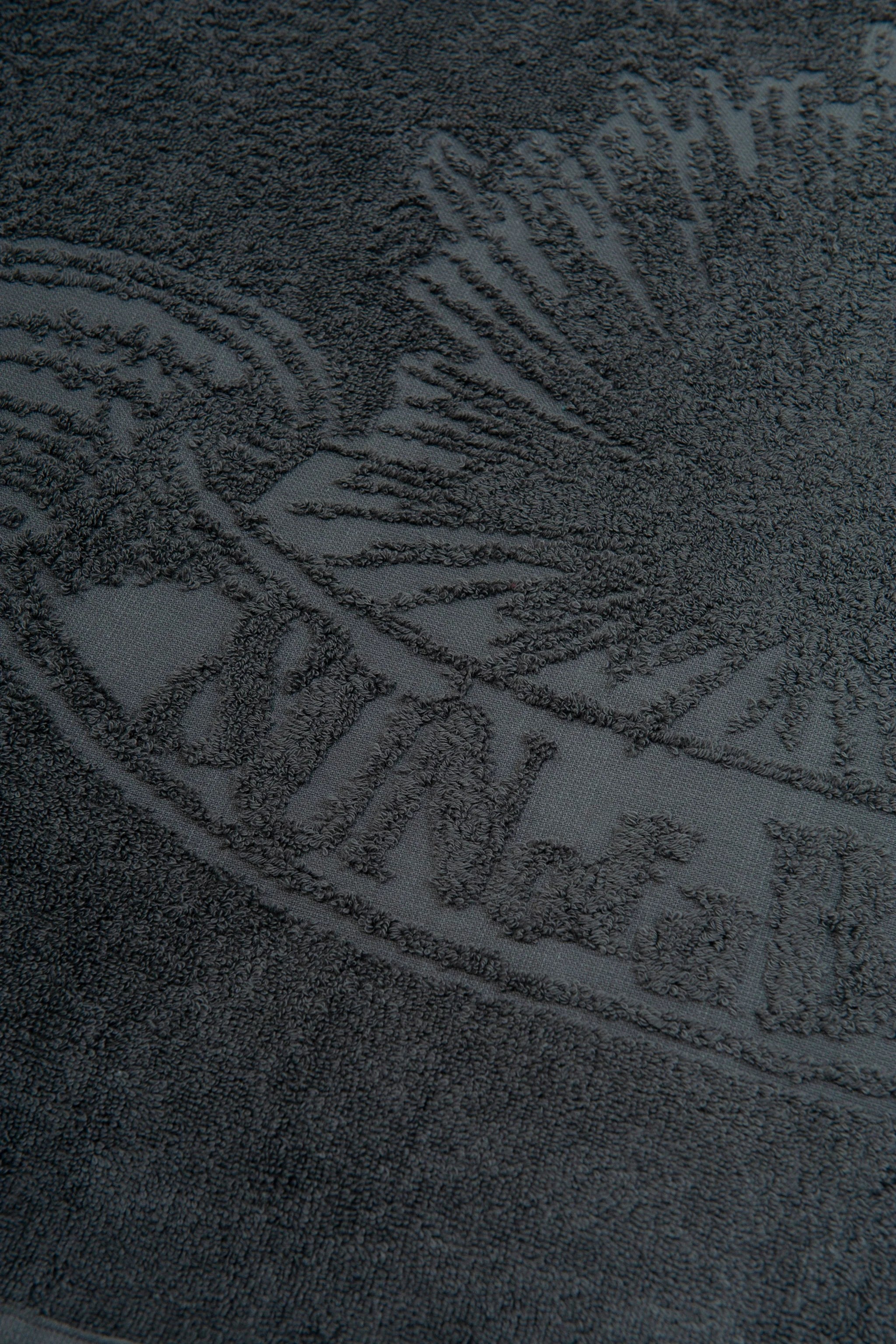 Close-up of a textured surface with a logo or brand name.