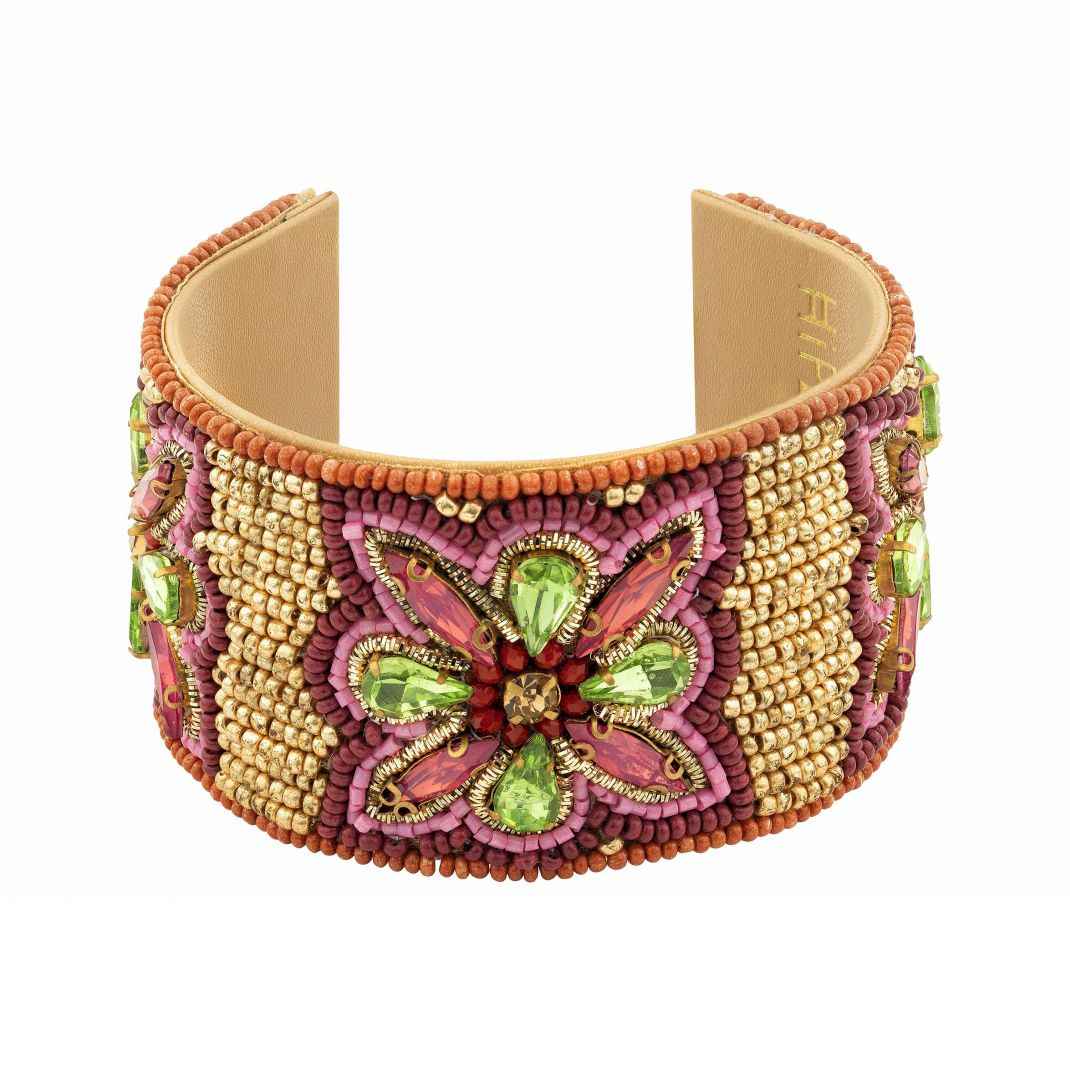 Decorative bracelet with butterfly design and colorful beads on a white background