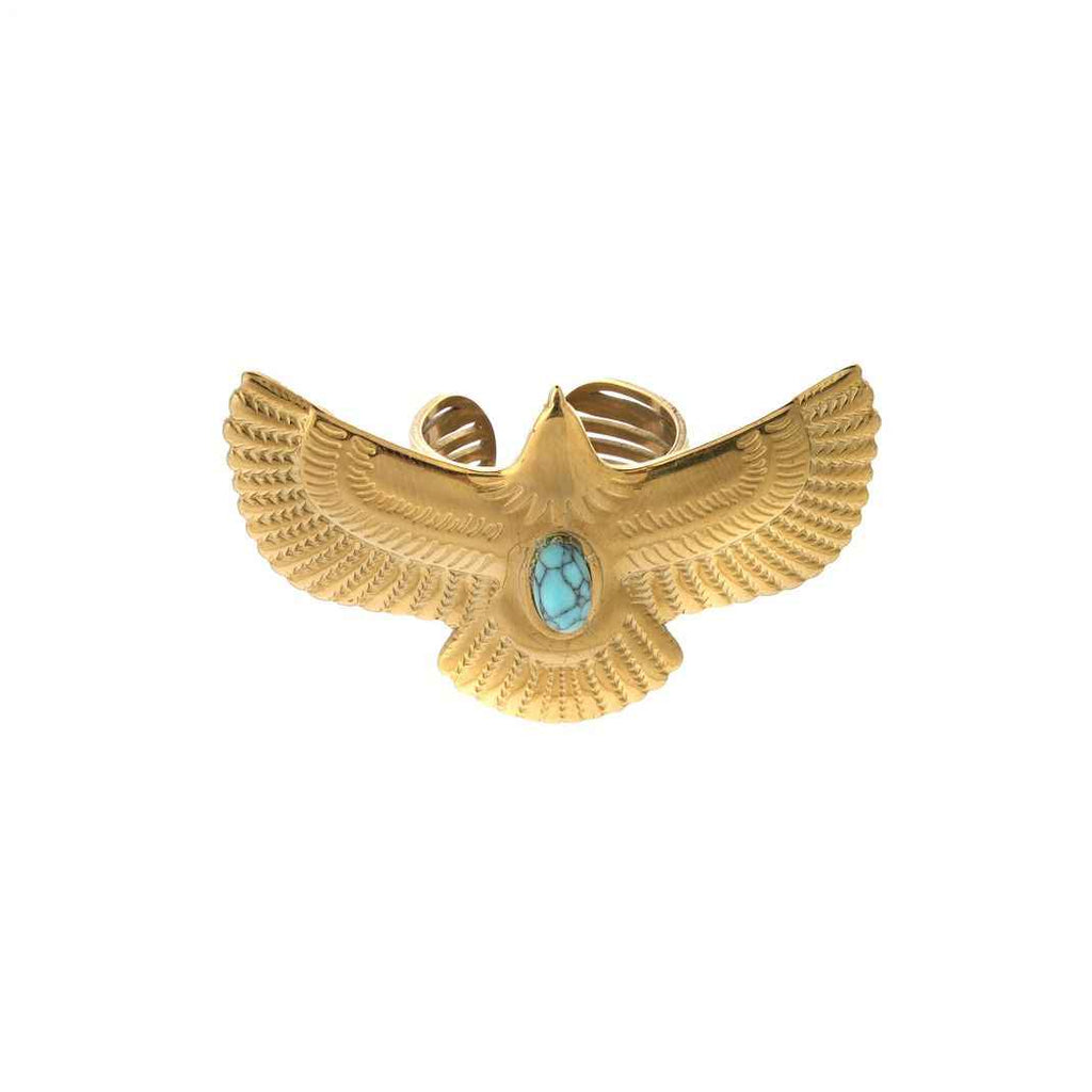 Gold eagle-shaped bracelet with a turquoise stone on a white background