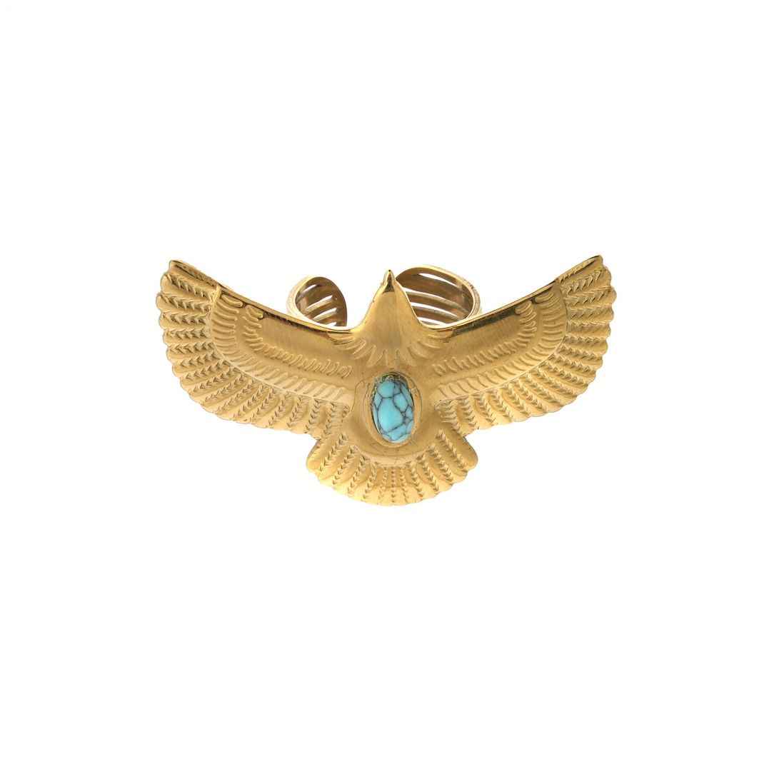 Gold eagle-shaped bracelet with a turquoise stone on a white background