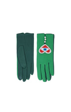 A pair of green knit gloves displayed flat against a white background. The left glove shows the smooth back, and the right glove shows the textured palm side with a decorative wrist patch featuring a red heart, white pearls, and a blue eye motif.