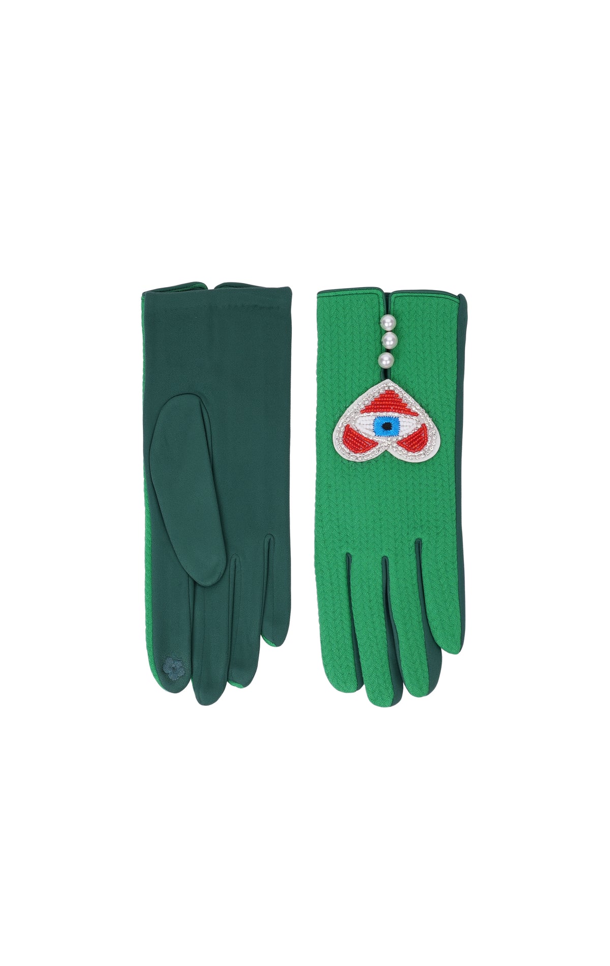 A pair of green knit gloves displayed flat against a white background. The left glove shows the smooth back, and the right glove shows the textured palm side with a decorative wrist patch featuring a red heart, white pearls, and a blue eye motif.