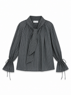 A dark gray and black vertically striped long-sleeve blouse with a tie-neck detail and gathered tie cuffs, shown flat on a white background.