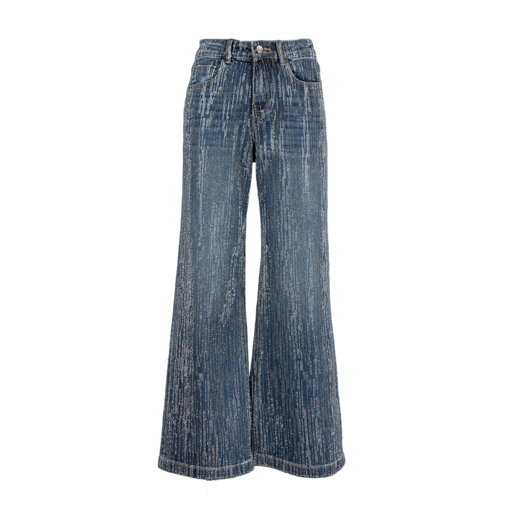 A pair of wide-leg denim pants in a faded blue wash with vertical whiskering and subtle distressing, shown against a plain white background.