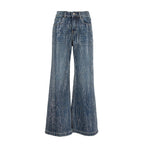 A pair of wide-leg denim pants in a faded blue wash with vertical whiskering and subtle distressing, shown against a plain white background.