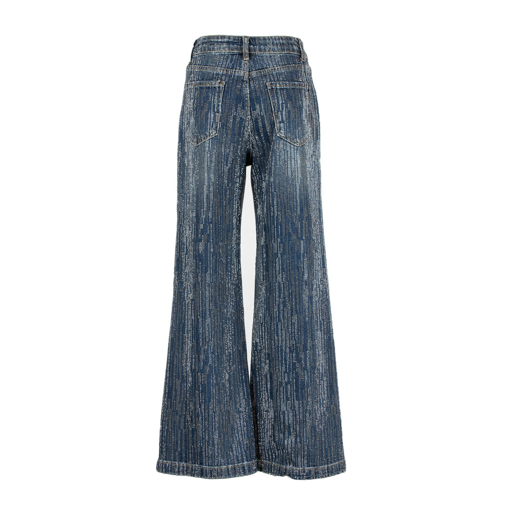 A pair of high-waisted, wide-leg jeans in a textured blue denim wash, shown from the back on a plain white background.