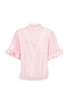 Pink blouse with ruffled sleeves on a white background