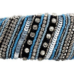 Set of beaded bracelets with blue, black, and silver beads on a white background